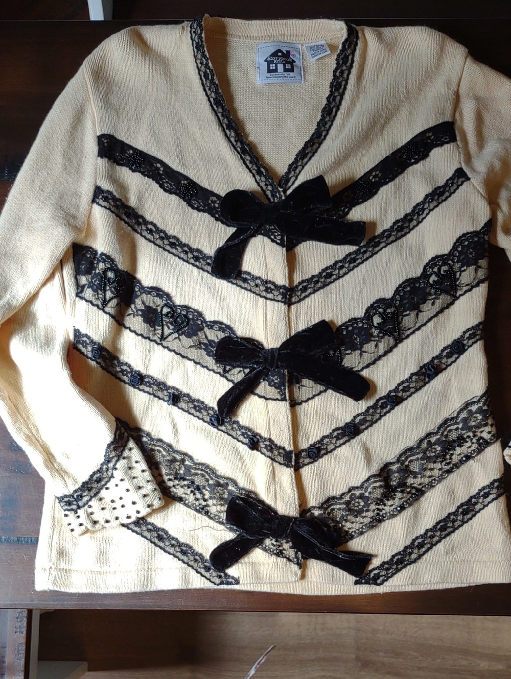 Storybook Knits Cream Cardigan with Black Lace & Velvet Bows
